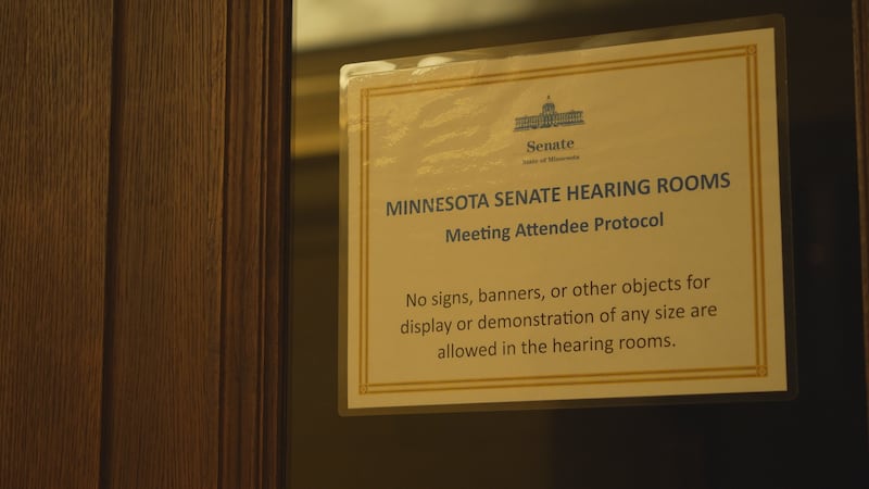 A sign posted outside of a Minnesota Senate Committee room advises guests on proper etiquette...
