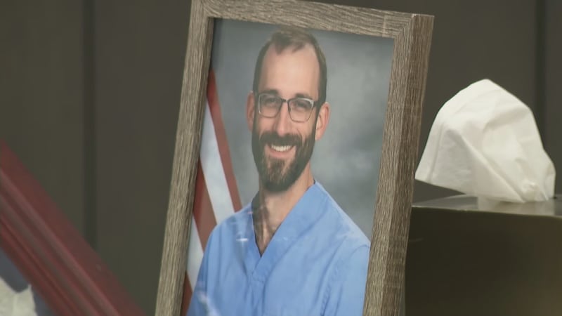 Alex Pretti's headshot, shown as Pretti's parents addressed members of the media for the first...