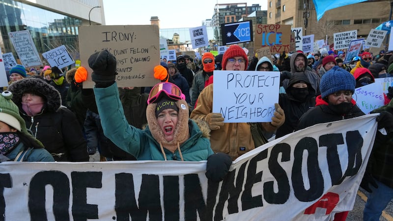 People protest against ICE (Immigration and Customs Enforcement) in downtown Minneapolis,...