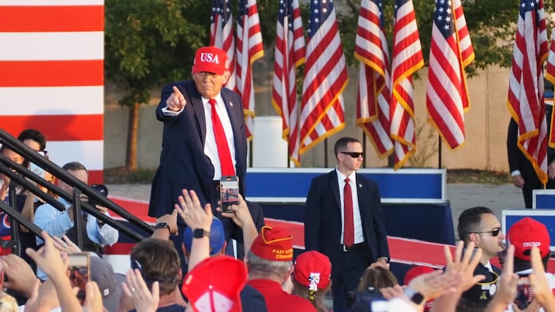 President Donald Trump waved and pointed to the crowd as he exited the stage following his...