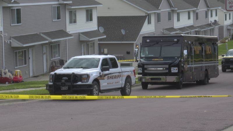 The Bureau of Criminal Apprehension outside of unit 23 at Bunker Lane Townhomes, where an...