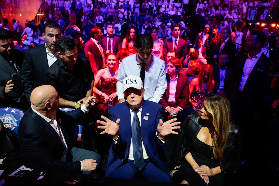 President Donald Trump, center, gestures as he attends UFC Freedom 250 alongside UFC President...