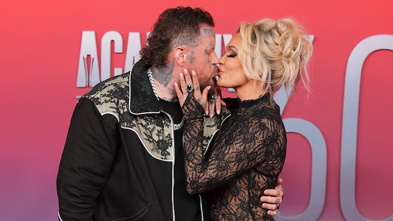Jelly Roll, left, and Bunnie XO arrive at the 60th annual Academy of Country Music Awards on...